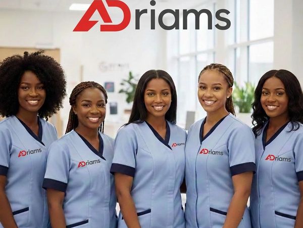 Five smiling women in blue uniforms with Adriams logo.