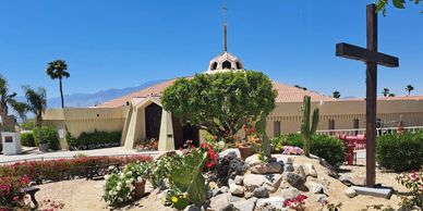 View of church from the garden with cross