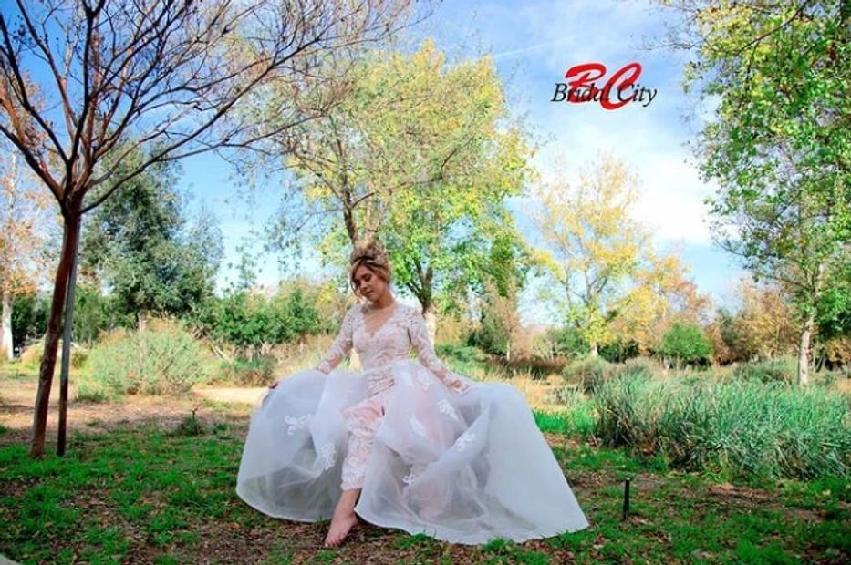 Bride with BridalCity wedding gown a park