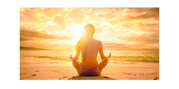 Meditation on the beach at sunrise