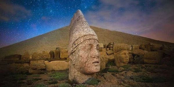Mount Nemrut stone heads under a starry sky, a unique stop on our private Turkey tours and custom itineraries.