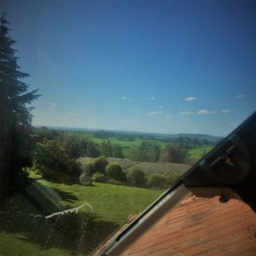 the view of the village of Exeter NSW behind a window being professioally cleaned