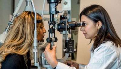 People having a comprehensive eye exam by a qualified optometrists at Cristall Opticians Toronto. Th