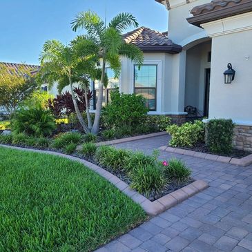 concrete landscape curbing along sidewalk and pavers