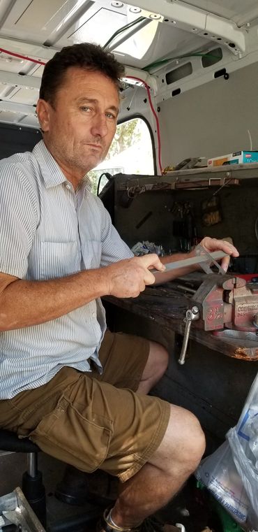 Locksmith filing lock strike