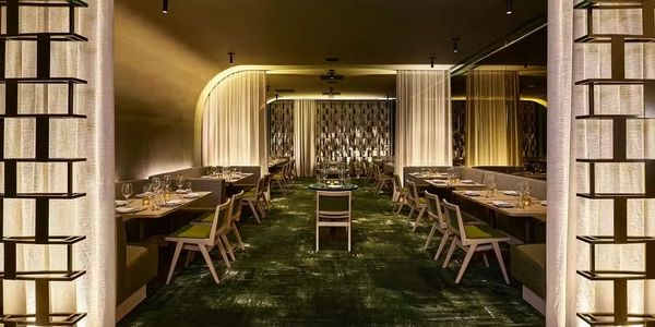 Elegant restaurant interior with warm lighting and modern design.