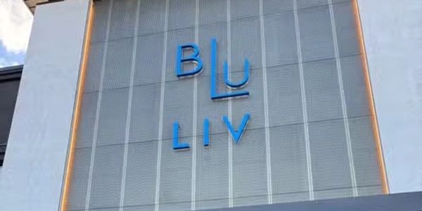 Blue LIV logo on a building facade.