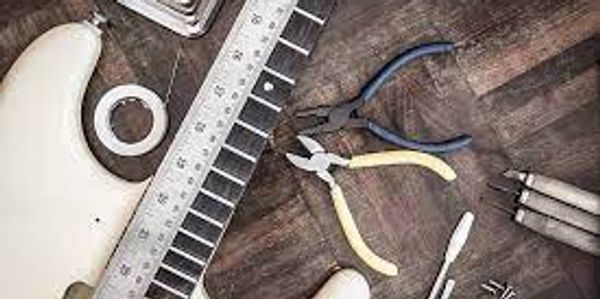 guitar with tools on a table