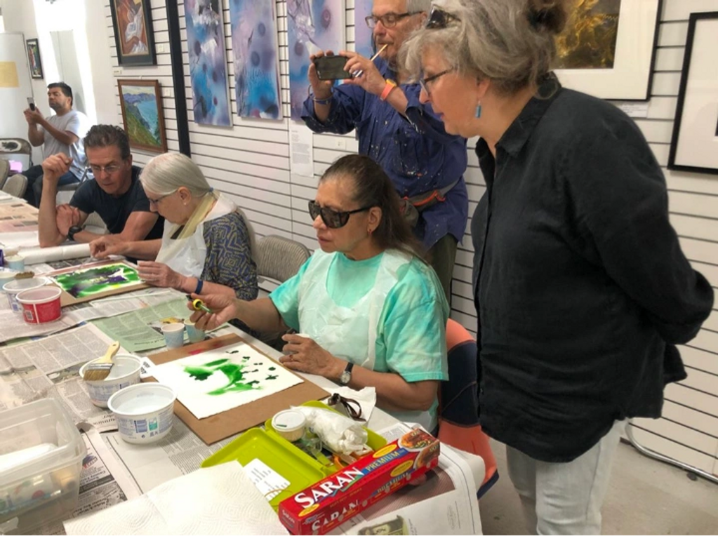 PARTICIPANT DOING ART WITH MARIN SOCIETY OF ARTISTS VOLUNTEER HELP