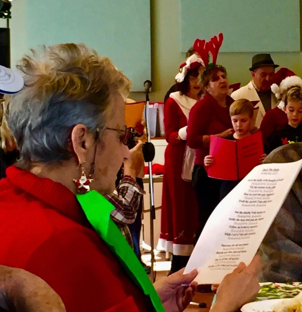 Large print music sheet to help us sing along with holiday chorus