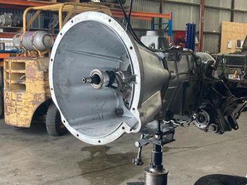 Transmission component mounted in a workshop.