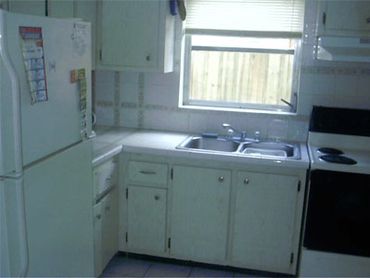 Small white kitchen window sink.