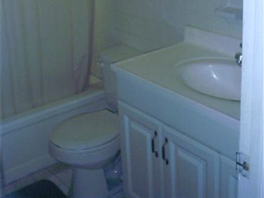 White bathroom toilet sink vanity.