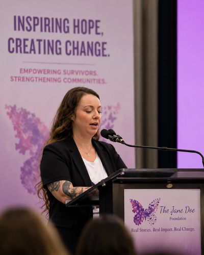 Speaker presenting at The Jane Doe Foundation event.