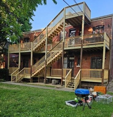 Two-story deck with full-height stairs and strong railings for multi-level outdoor use.