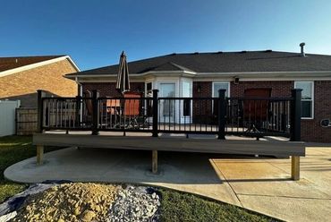 Composite deck railing installed for extra safety and modern aesthetics.