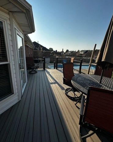 Multi-level gray composite deck with clean railing lines and durable outdoor framing.
