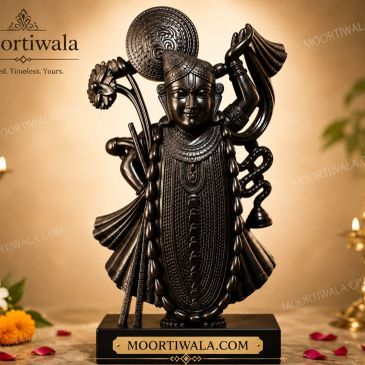 Intricate black statue of a deity with detailed ornaments.