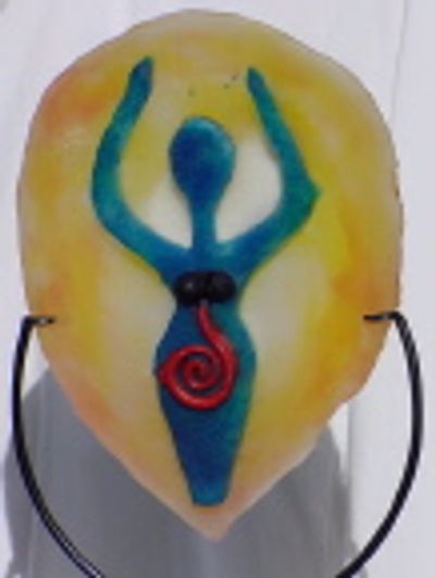 Colorful pendant with a blue figure and red spiral on yellow background.