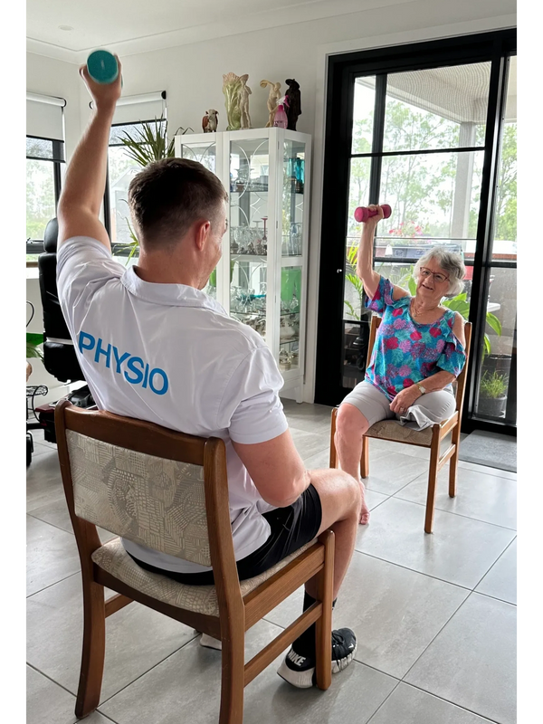 Grant during an in-home physiotherapy session with one of his clients