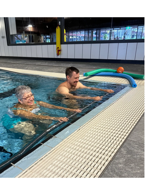 Hydrotherapy session with a client at a local pool