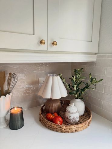Cozy kitchen corner with decorative lamp, greenery, and Zellige tile backsplash in Port Orchard, Was