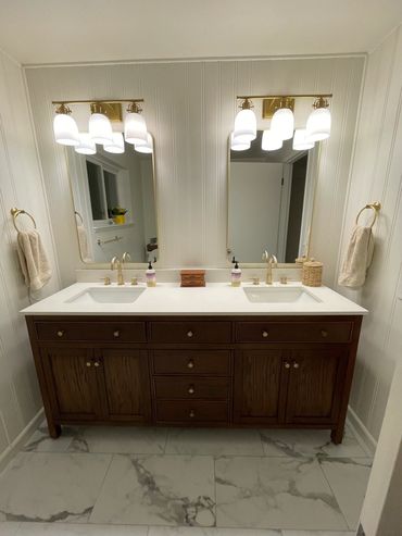 Beautiful bathroom with 72" vanity, LVP flooring and gold accents in Port Orchard, Washington.