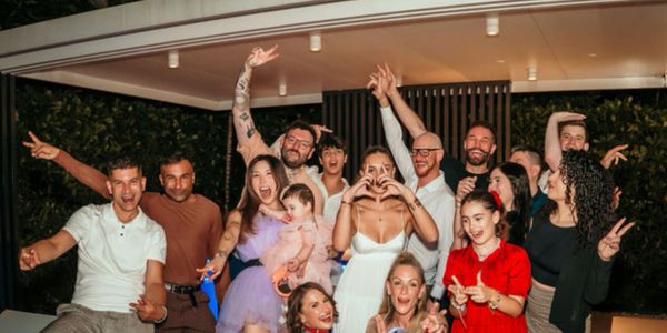 This heartfelt moment showcases Kyle David surrounded by a loving group of friends celebrating life.