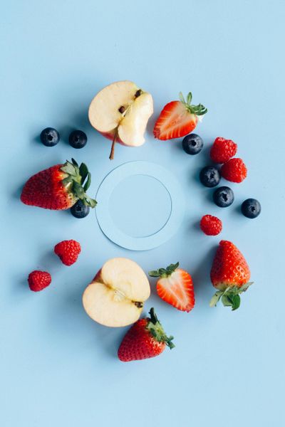 A blue circle surrounded by fruit