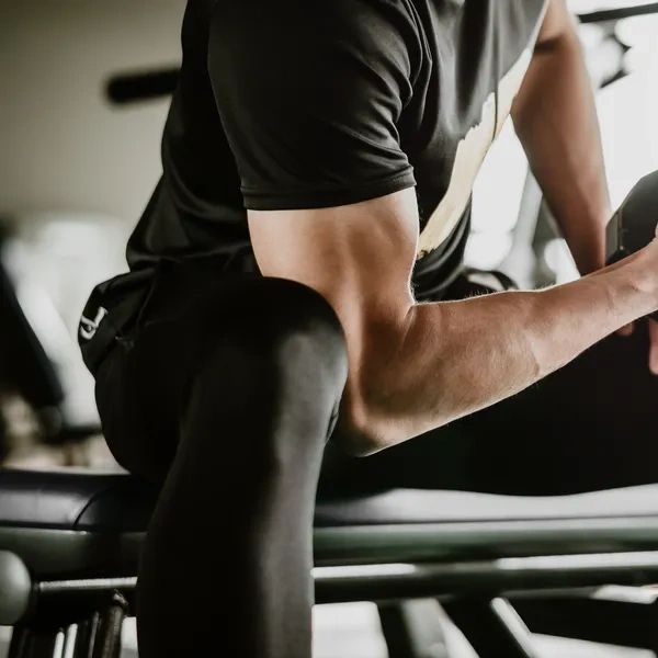 Man working out with dumbbells at the gym.