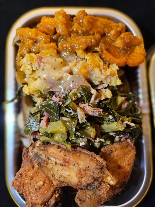 The soul food potato candy yams, collard greens, cornbread dressing, with smoked turkey meat, thrown
