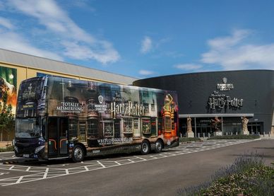 Harry Potter-themed bus and building.