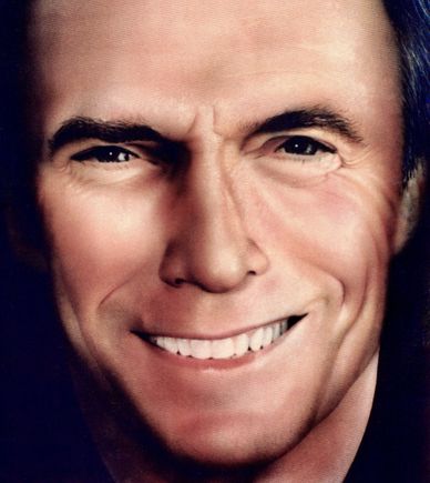 Close-up of a smiling man's face showing eyes and mouth.