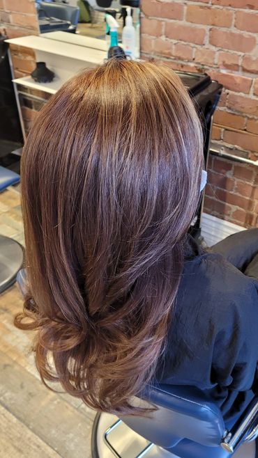 Dimensional brunette color, soft caramel tones by Adriana Balea at Studio B Toronto.