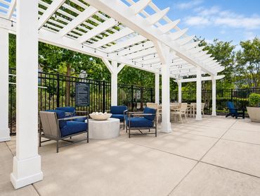 Windsor Leesburg pool deck reimagined as outdoor living with a new pergola and shaded lounges