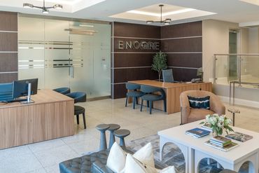 Multifamily interior leasing office with modern furnishings designed by Design by DuBois