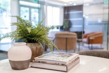 Multifamily interior leasing office decor close up designed by Design by DuBois