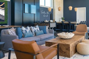 Multifamily rooftop amenity featuring durable materials, deep blue accents, and warm wood tones