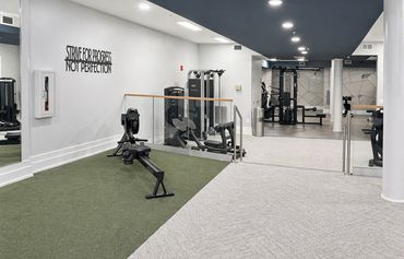 Light-filled fitness center at Windsor Leesburg combining two unused amenities with the original gym