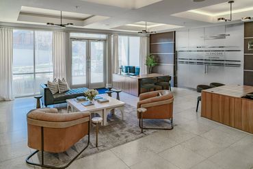 Multifamily interior leasing office with modern furnishings designed by Design by DuBois
