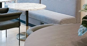 Resident lounge at Windsor Encore with communal seating, work-from-home zones, and graphic wallpaper