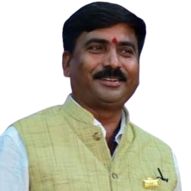 Man smiling wearing traditional Indian vest.