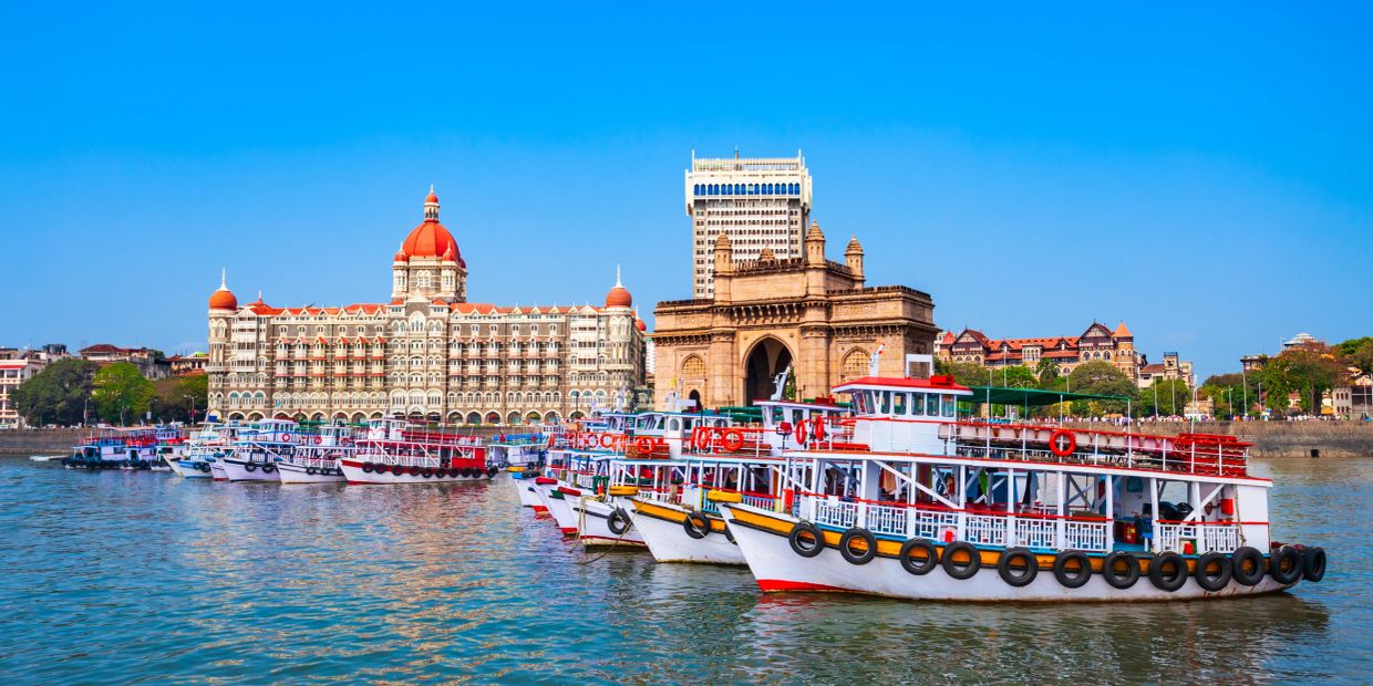 Boats docked near the Gateway of India and Taj Mahal Palace in Mumbai.