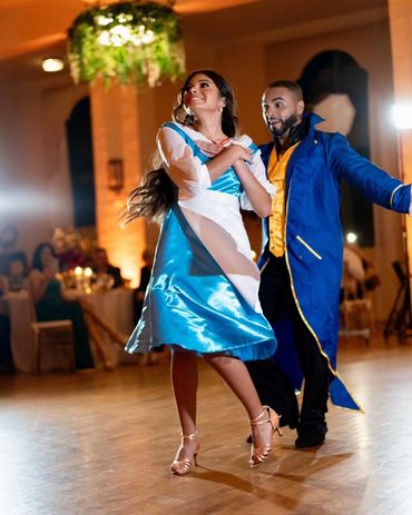 Couple dancing in colorful costumes.