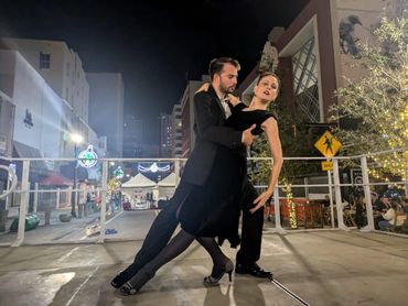 woman and men dancing tango