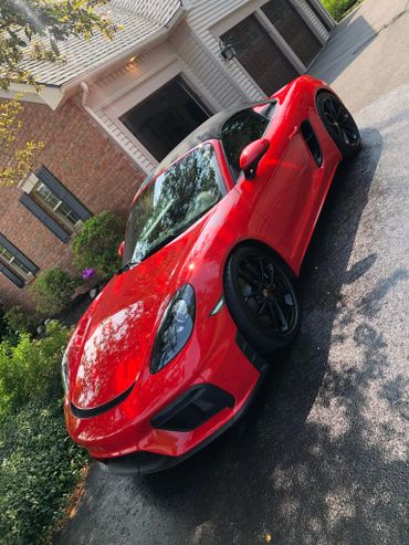 red porsche that was just cleaned inside and out