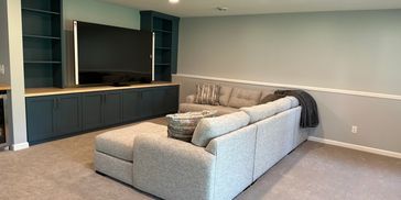 Ramsey, MN Basement Remodel
Plush carpet, custom cabinets, canned lighting, and oversized sectional.