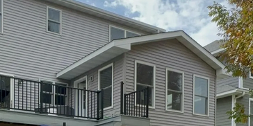 St. Michael, MN Four-Season Porch Addition
Four-season porch with gray siding and custom windows.