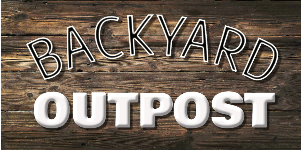 Rustic wooden sign reading 'Backyard Outpost' with contrasting text styles.