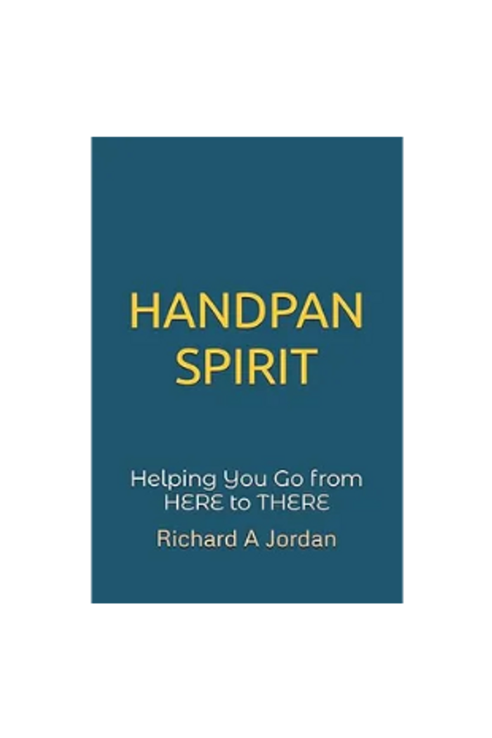 Stack of books next to pencils in a holder and a camera.